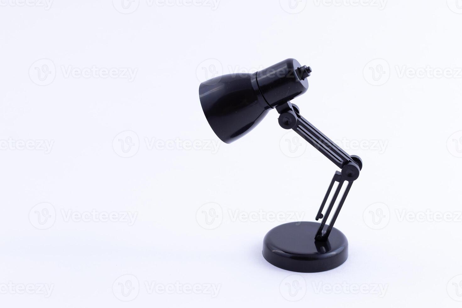 Table Lamp Mini Model. Small Black Desk Lamp on White Background photo