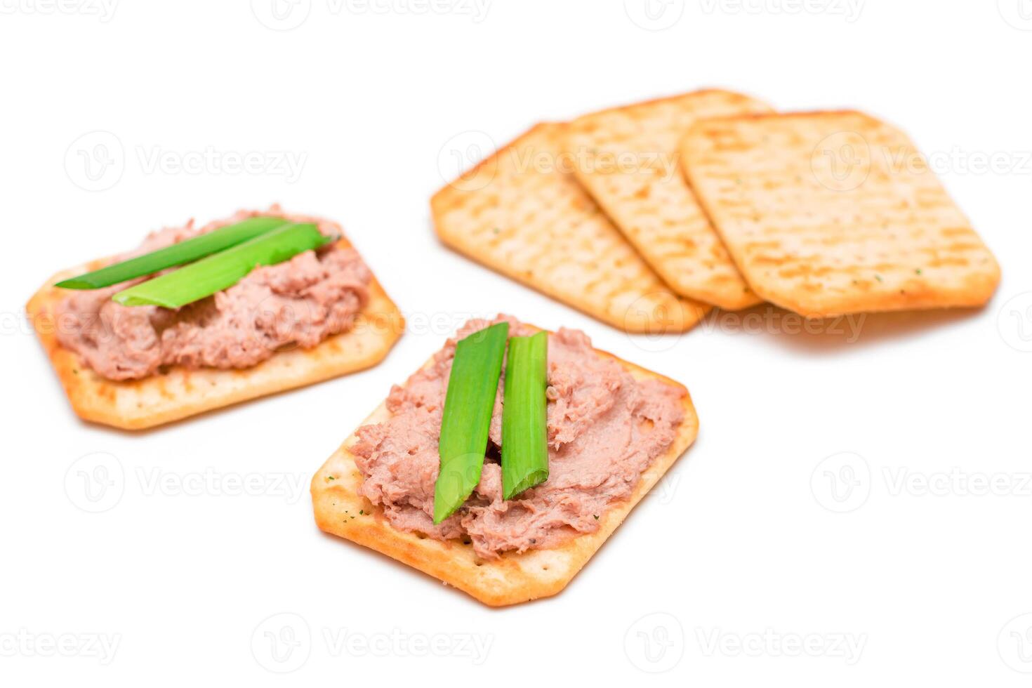 Crispy Salted Crackers with Liver Pate, Green Onions and Olives - Isolated on White. Easy Snack - Isolation photo