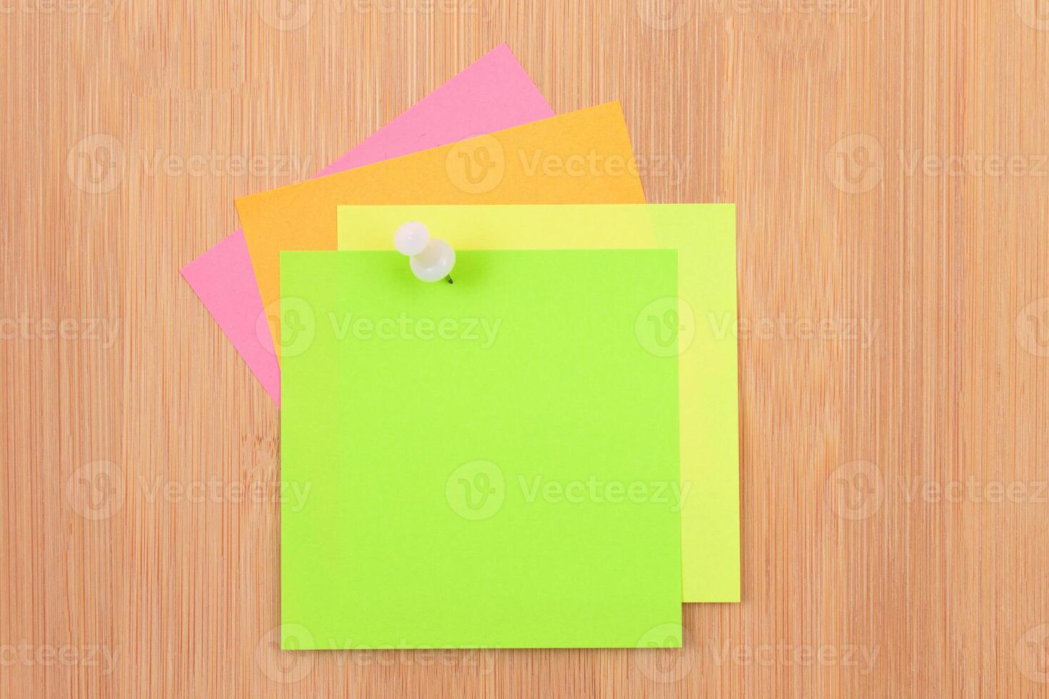 Colored Sticky Notes with Copyspace Pinned to the Wooden Message Board. To Do List Reminder in Office. Blank Memo Sticker at Work - Template. Empty Checklist - Mockup photo