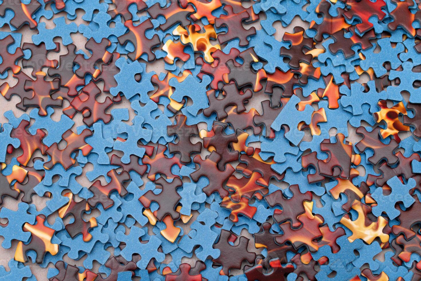 Top View of Mixed Pieces of a Jigsaw Puzzle - Texture Background photo