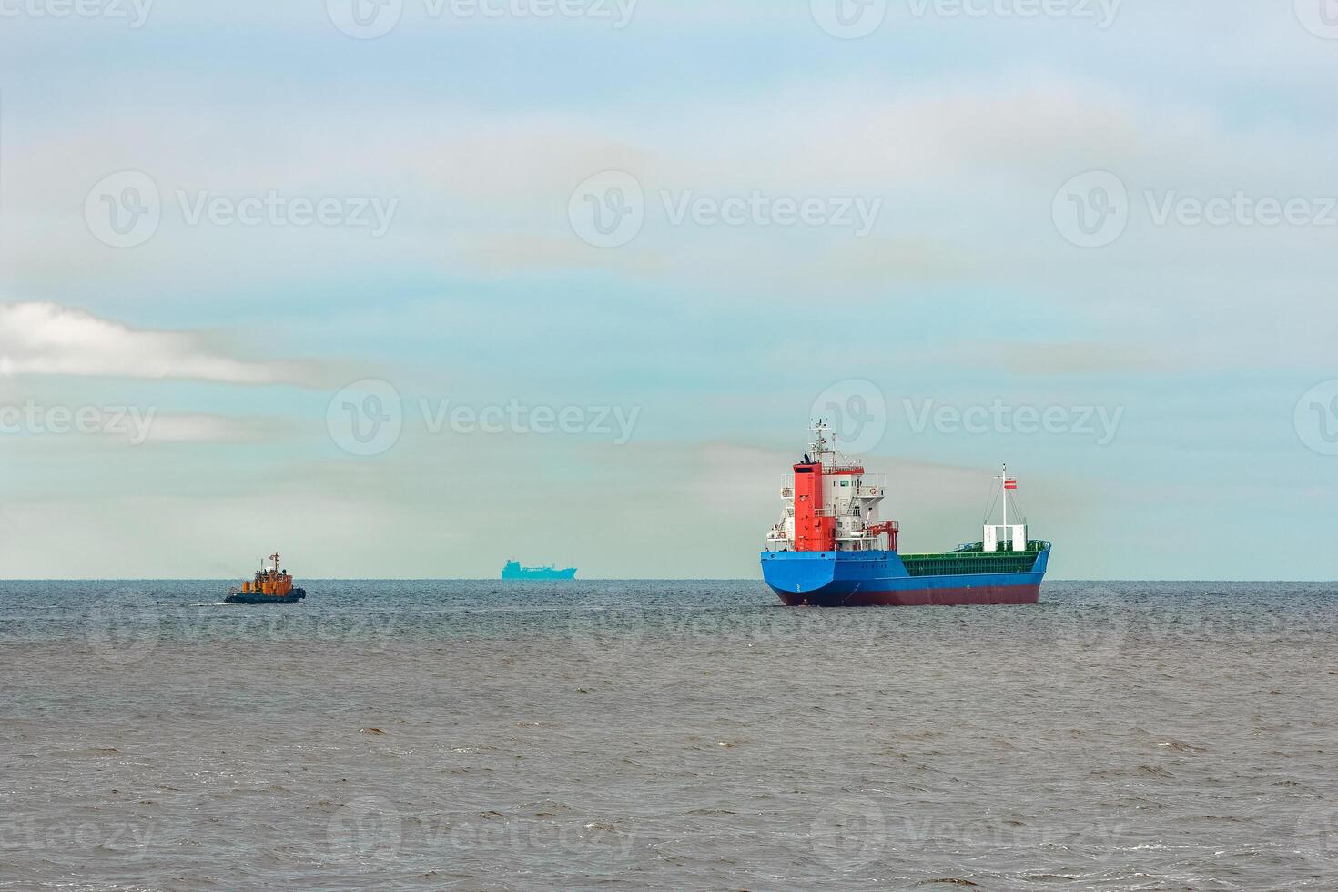 Blue cargo ship entering the Baltic sea. Riga, Europe photo