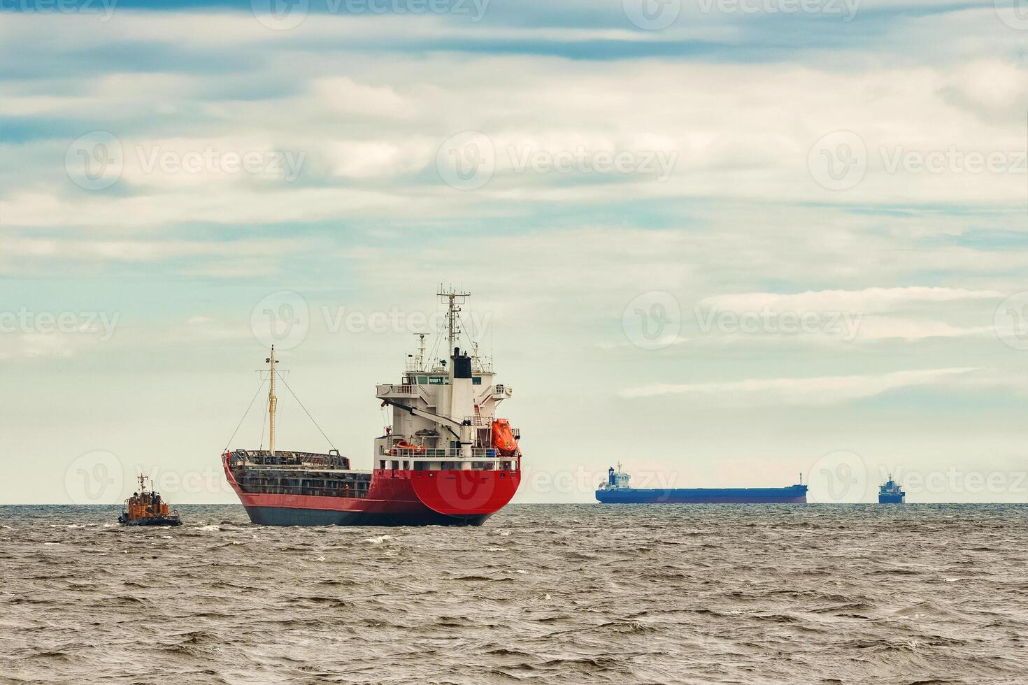 Red new cargo ship moving abroad. Product export in Europe photo