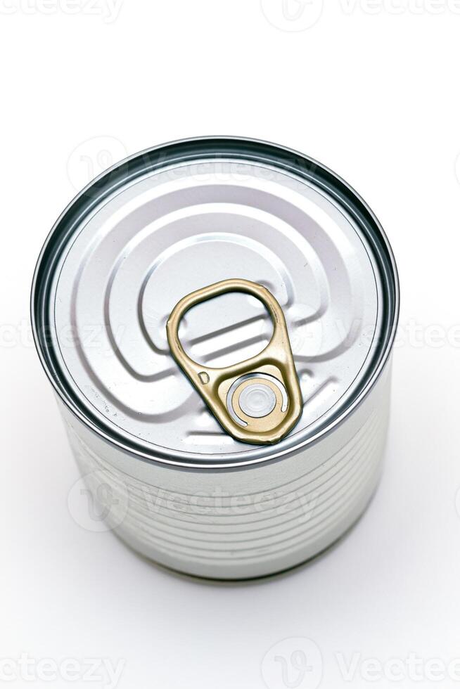 Unopened Tin Can with Blank Edge on White Background. Canned Food. Aluminum Can for Safe and Long Term Storage of Food. Steel Sealed Food Storage Container photo