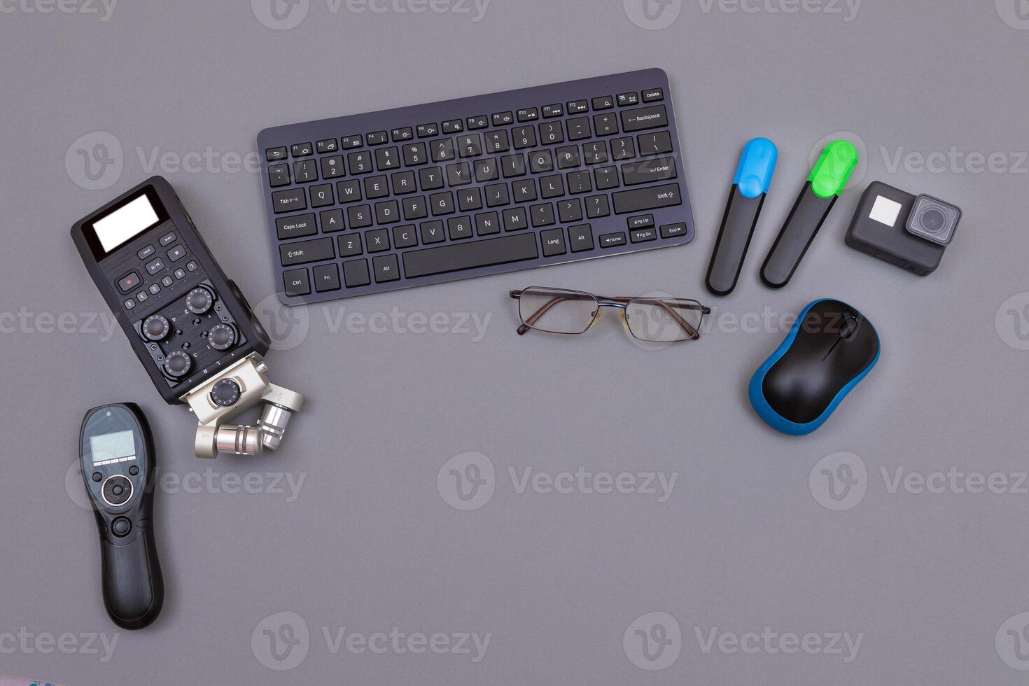Top View of Blogger's Workplace. Digital Gadgets Lying on Grey Table - Flat Lay photo