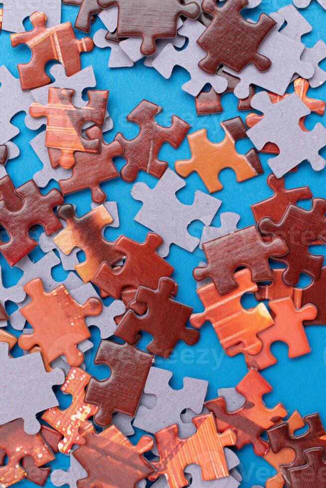 Top View of Mixed Pieces of a Jigsaw Puzzle - Texture Background photo