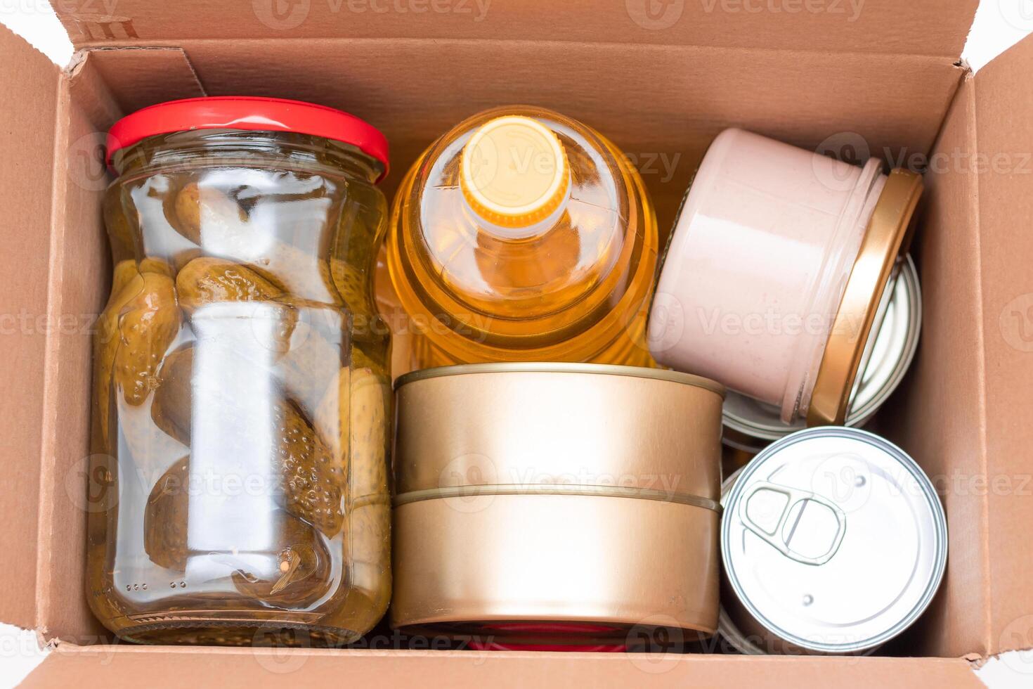 Food Reserves or Donation Box. Carton Box with Canned Food, Cereals and Grocery. Emergency Food Storage in Case of Crisis. Free Social Help, Blessings and Care. Strategic Food Supplies photo