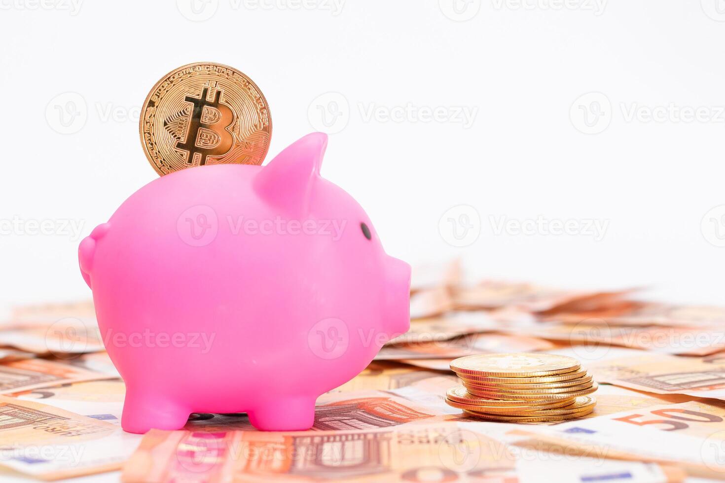 Pink Piggy Bank with Bitcoin Coin on the Fifty Euro Banknotes. Small Money Box for Cash and Coins. Money Saving Concept photo