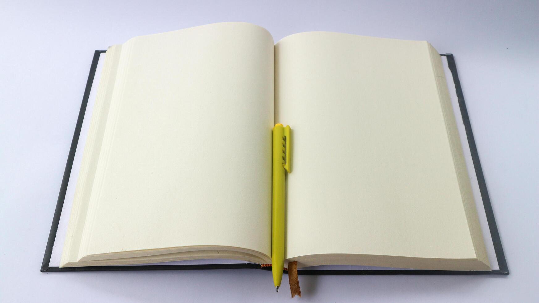 White plain diary or blank journal for writing memo, note and message. Sketchbook or booklet with open page for business, studying, or learning. Notebook mock up design concept for office or lifestyle photo