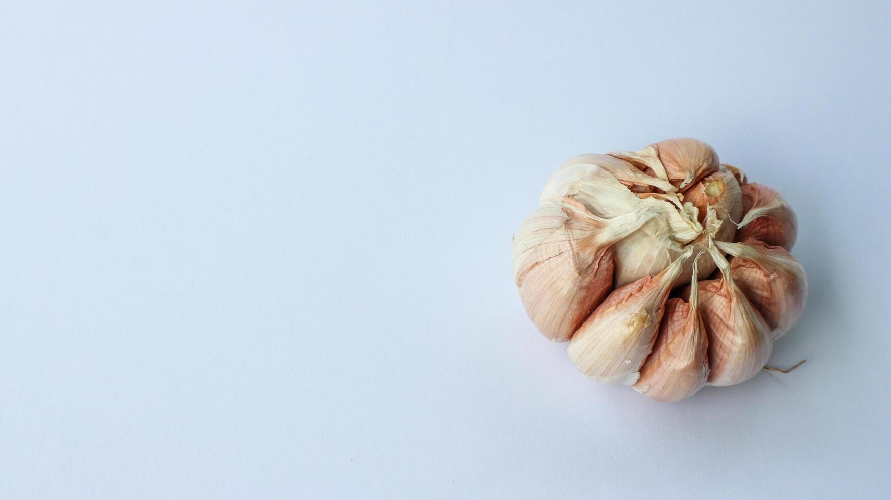 Garlic isolated on a white background. Top view. Flat lying pattern. photo