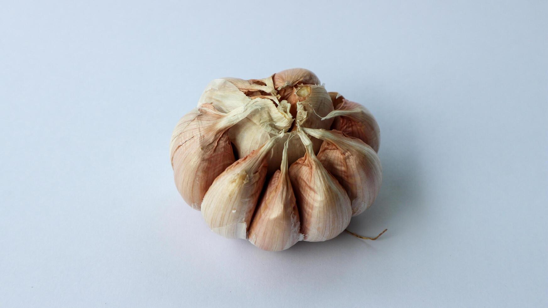 Garlic isolated on a white background. Top view. Flat lying pattern. photo