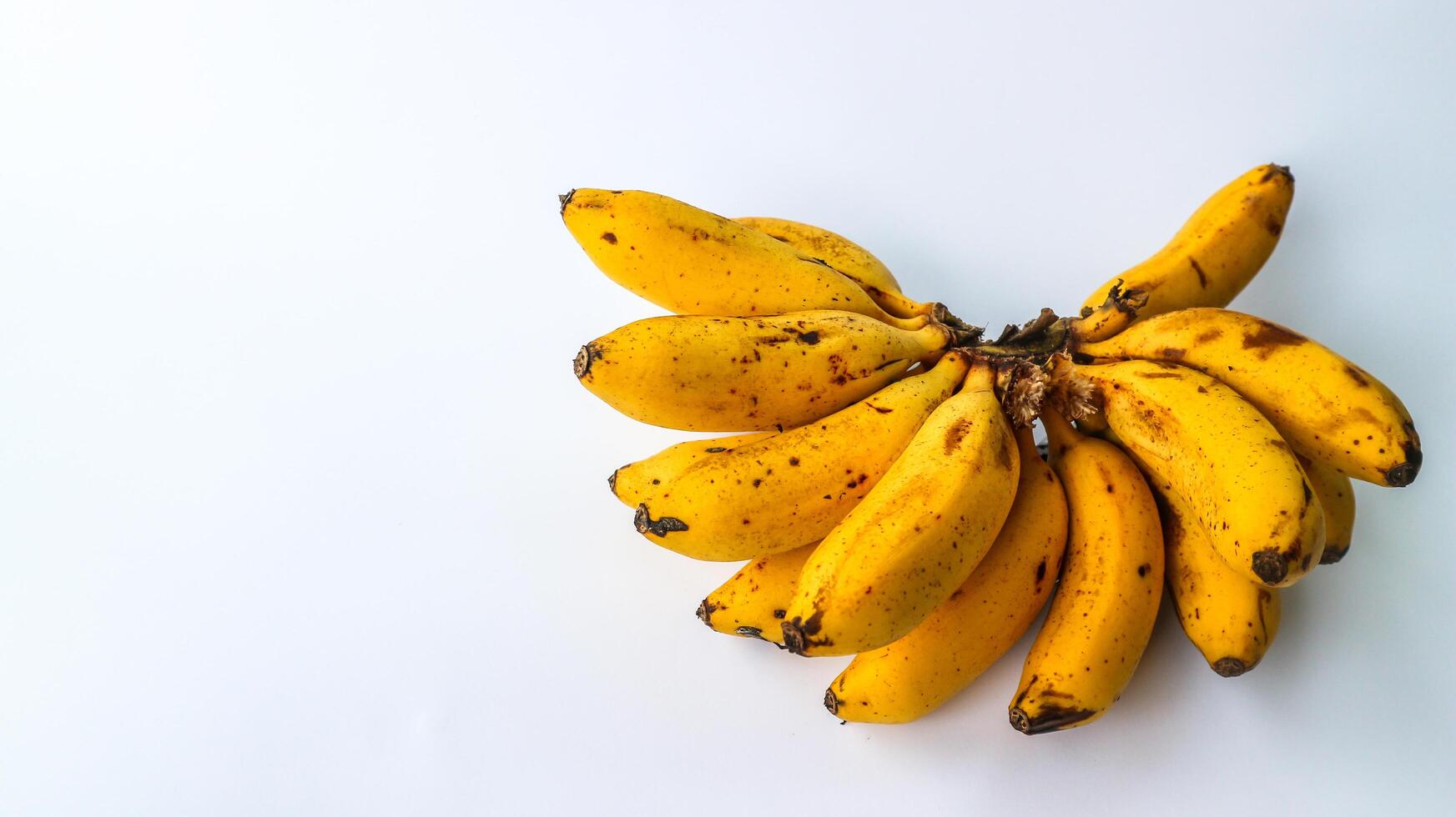 A group of isolated banana fruits. Banana peel cut alienated on white background. photo