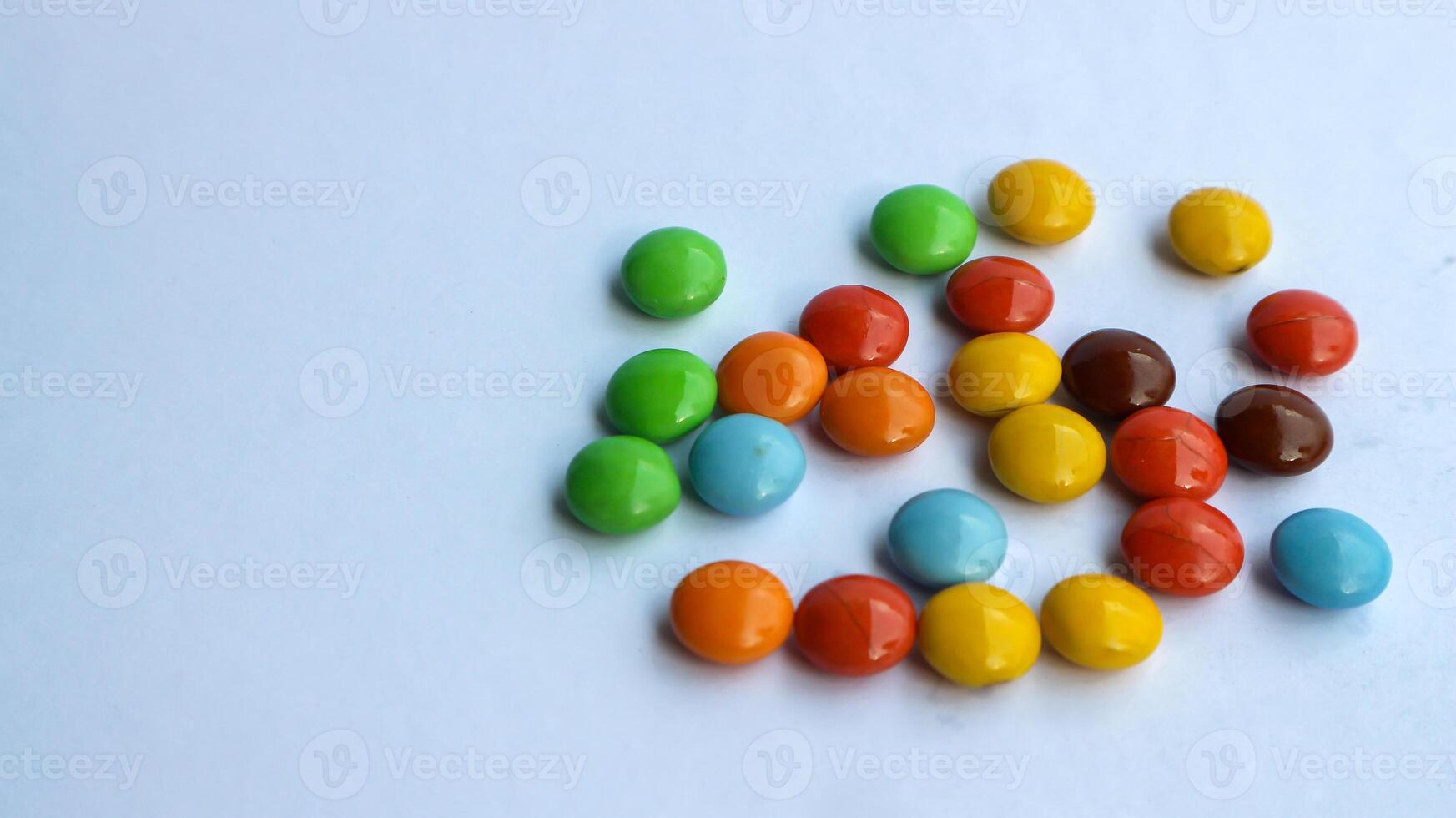 Colorful candies isolated on white with space for your text. photo