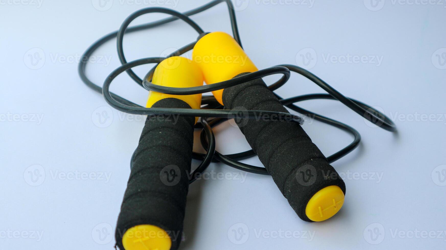 Skipping rope on a white background. Skipping rope is a useful exercise tool for cardio training. For those who are increasing strength and losing weight. photo