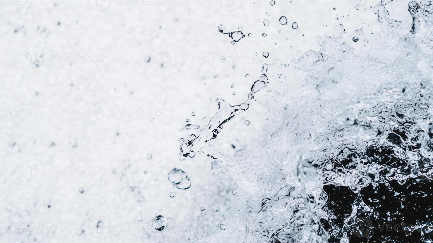 Water splashes create dynamic patterns, showcasing beauty of natures movement and energy. droplets dance in air, reflecting light and creating refreshing atmosphere photo