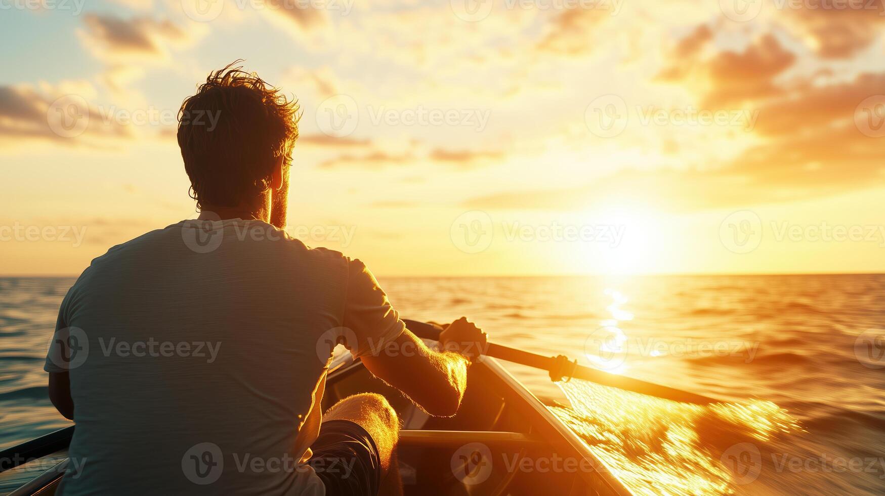 person rows boat on tranquil sea during stunning sunset, creating serene and reflective atmosphere. golden hues of sun illuminate water, enhancing peaceful experience photo