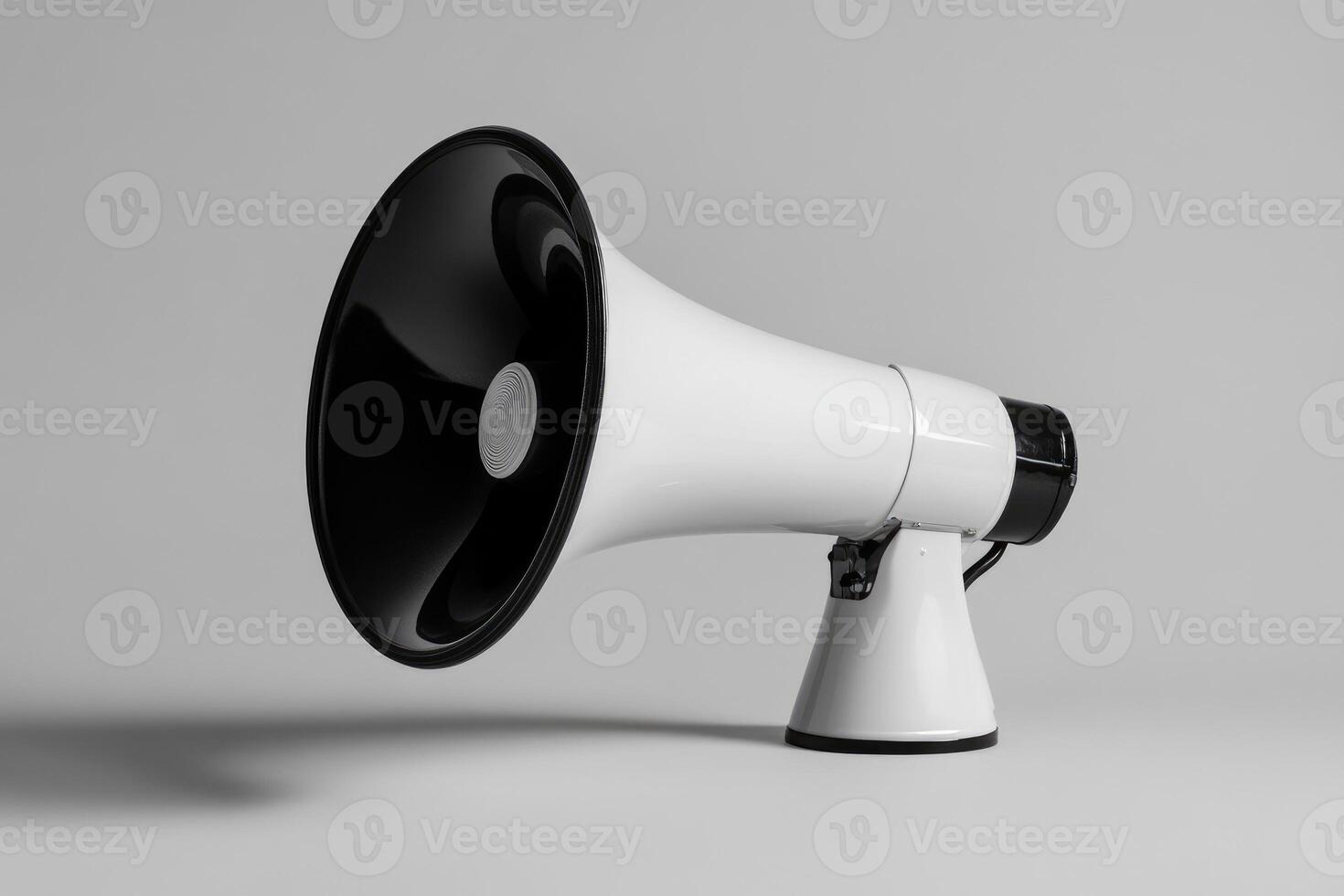 White megaphone with black speaker and handle on gray background photo