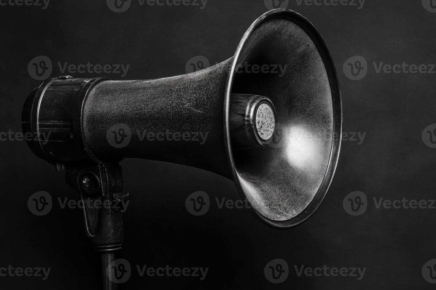Black Megaphone with a Textured Surface on a Black Background photo