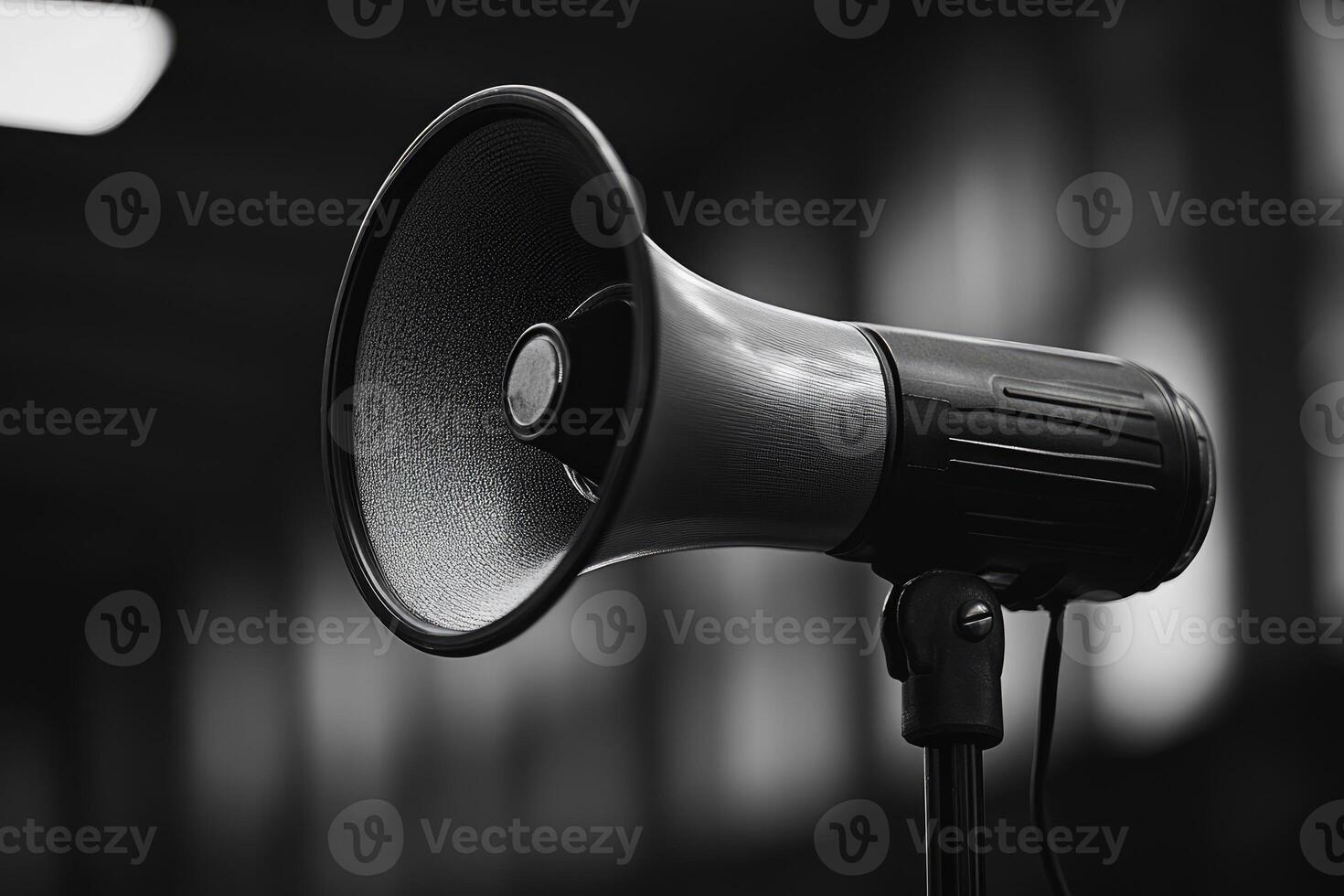 A Black and White Close-Up of a Loudspeaker on a Stand photo
