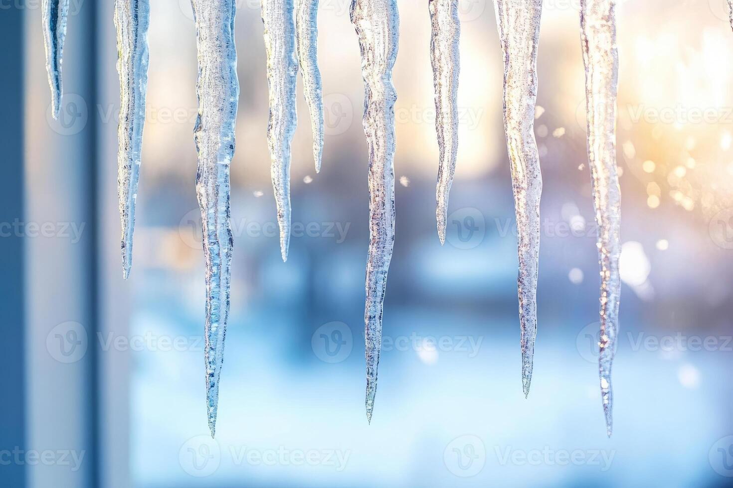 A Close-Up of Icicles Hanging from a Windowsill photo