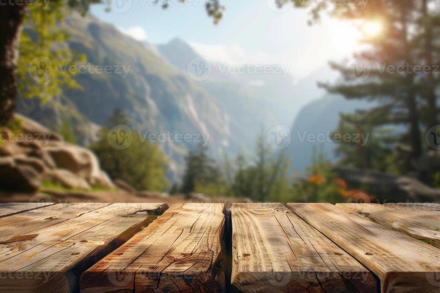 Wooden table with free space for decorating. Blurred mountain camping background, morning light. photo