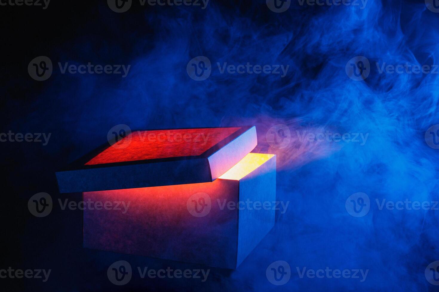 Man opens magic box with surprise on dark background, mystical box, surprise, halloween photo