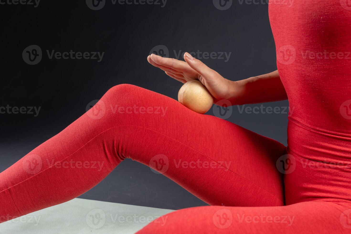 Myofascial relaxation of the leg muscles with a massage ball. Prevent leg fatigue, self massage tool photo