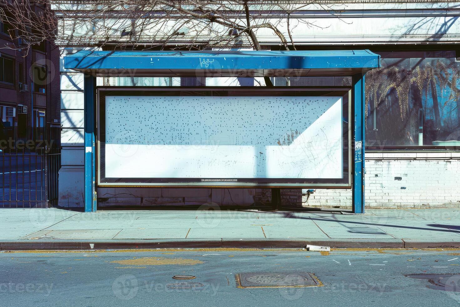 A bus stop with a white board on it photo
