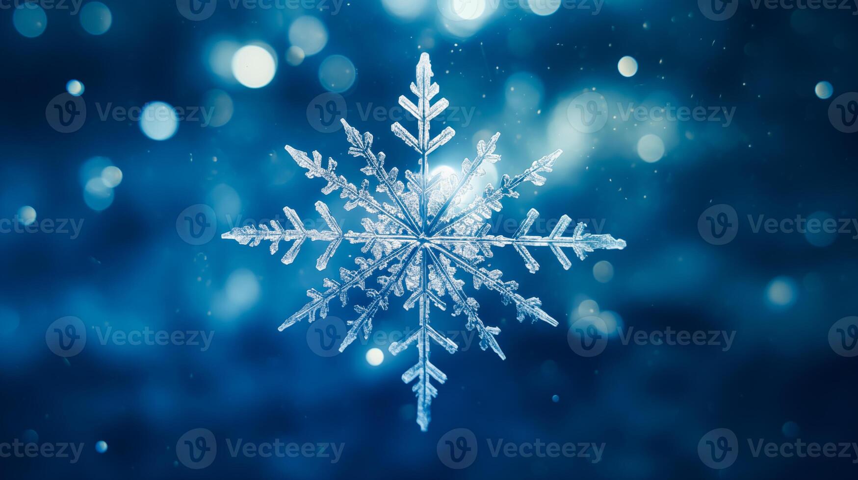 Snowflakes on ice, deep blue background photo