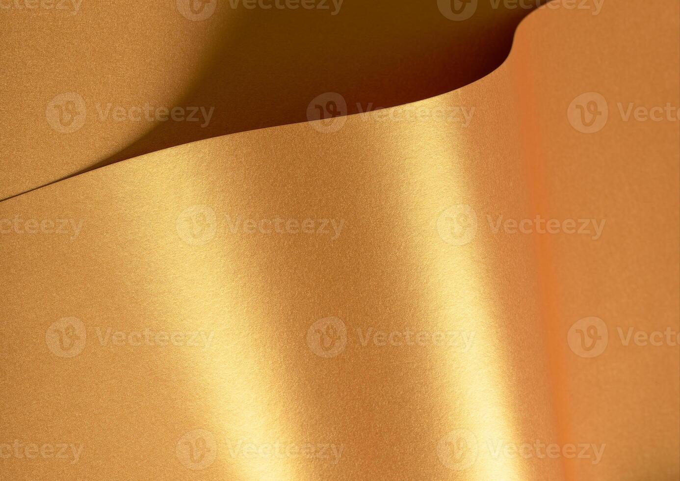 Golden paper with a metallic texture, featuring chic waves and glossy reflections in brass and photo