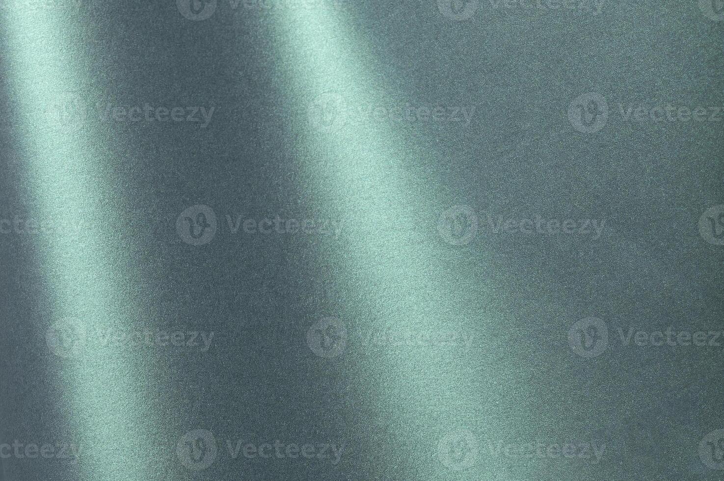 A glowing, shiny teal to aqua gradient paper with chic, classy reflections and a glossy finish. The photo