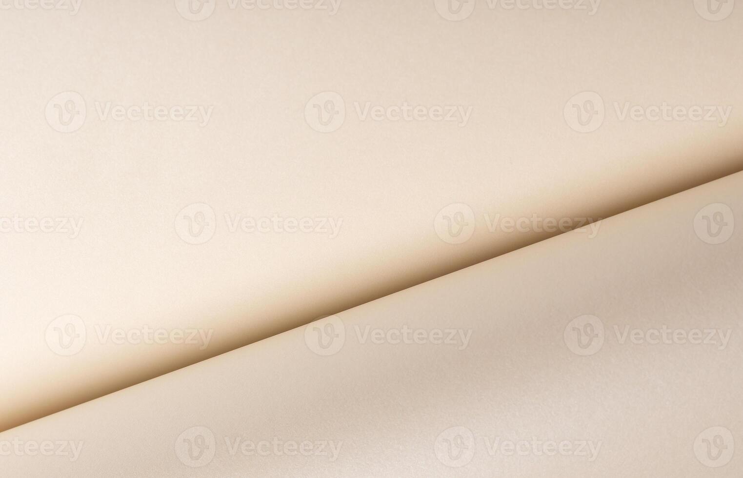 Beige paper with a smooth texture and layered folds. The neutral surface exudes a chic, classy photo