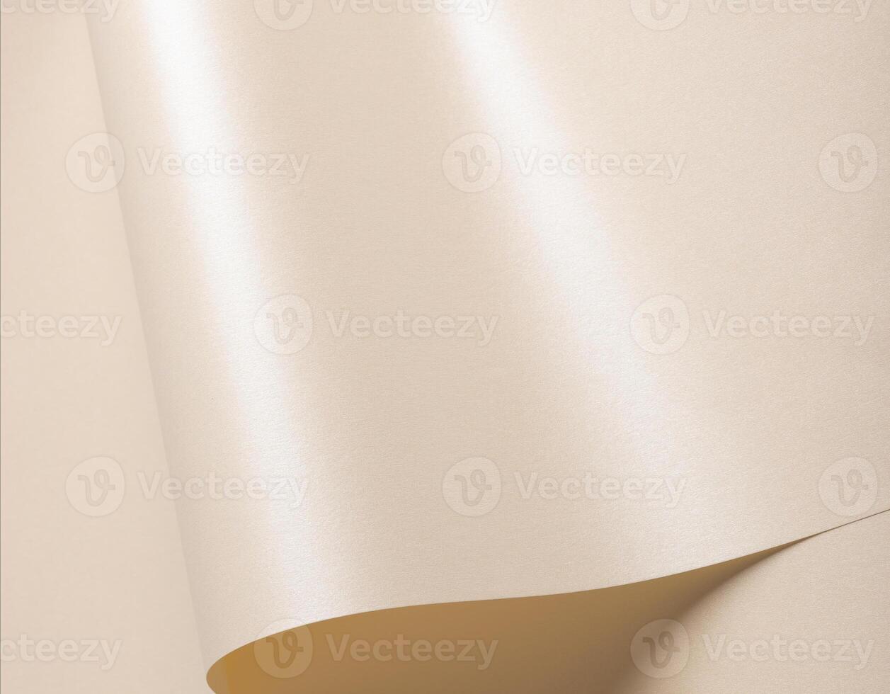 Beige paper with a smooth sheen and elegant, reflective folds. Glossy surface features soft, wavy photo