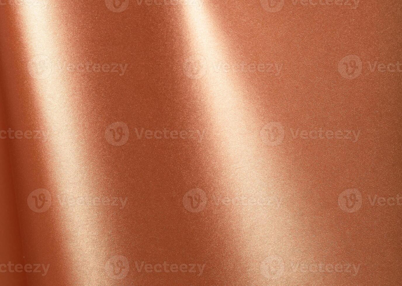 Copper metallic surface with a reflective, smooth texture and glossy sheen. Elegant and modern photo