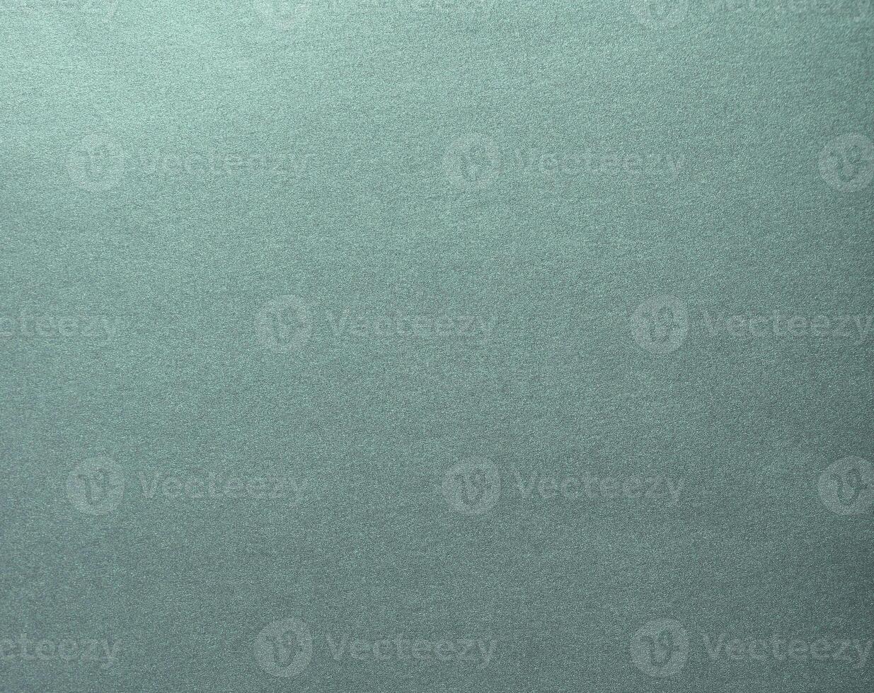 A glowing, shiny teal gradient paper with chic reflections and a glossy, smooth surface. The photo