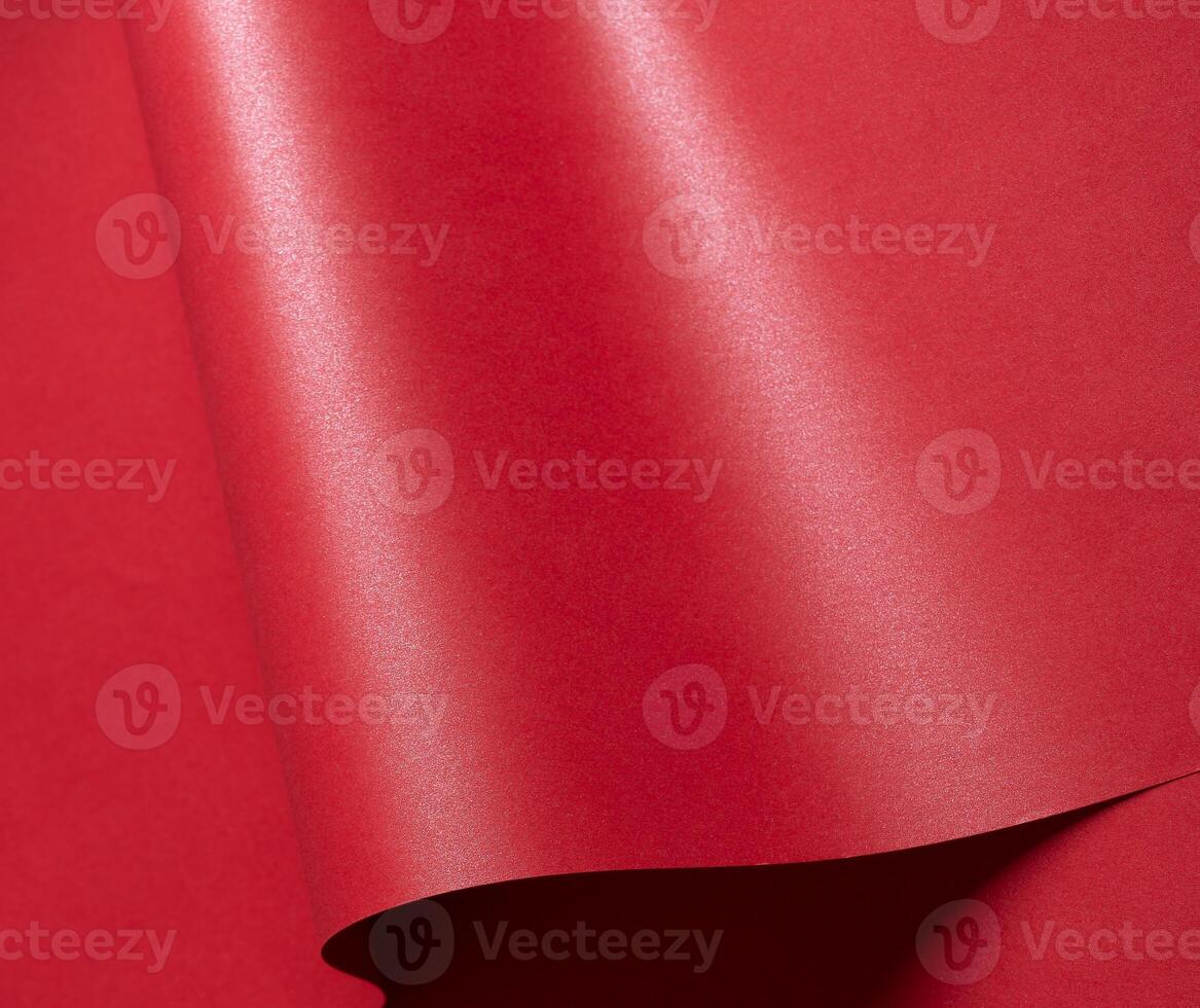 A gorgeous gradient paper with saturated scarlet tones and wavy, curved lines. The glossy surface photo
