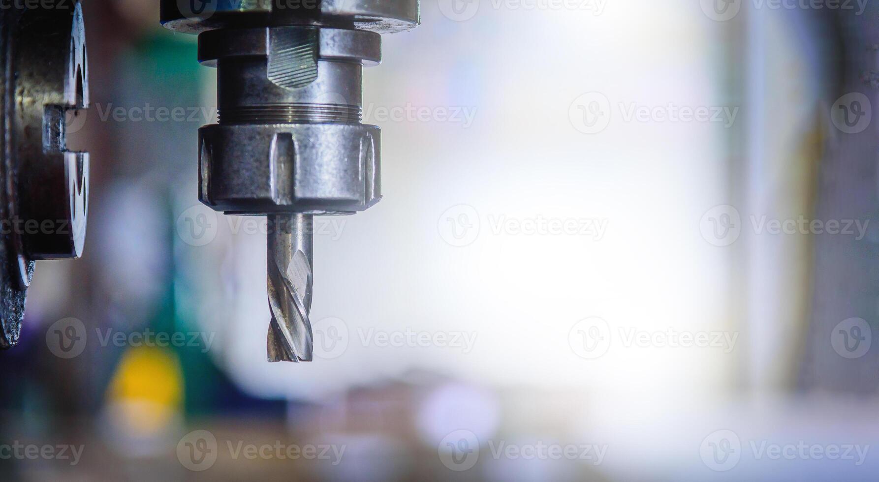 Detail of vertical drilling machine in factory workshop. photo