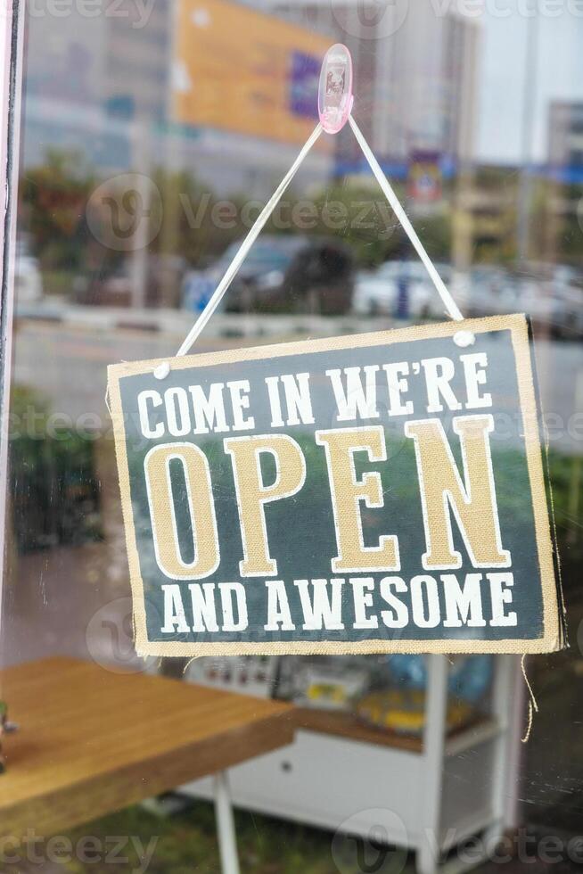 Charming Open Sign Inviting All Customers to Enter and Experience Pure Awesomeness photo