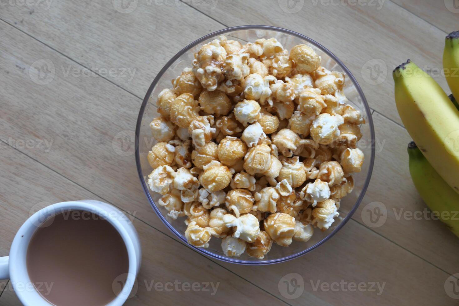 Enjoy a bowl of delicious caramel popcorn bursting with flavors of coffee and ripe bananas photo