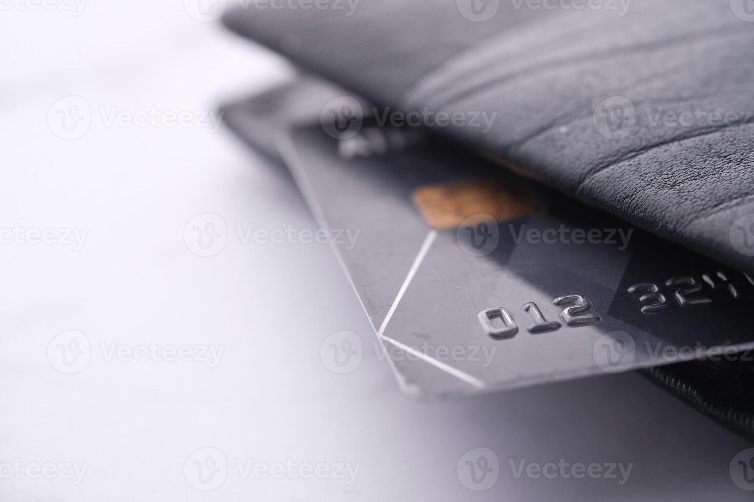 A detailed closeup view of numerous Credit Cards neatly arranged in a stylish Black Wallet photo