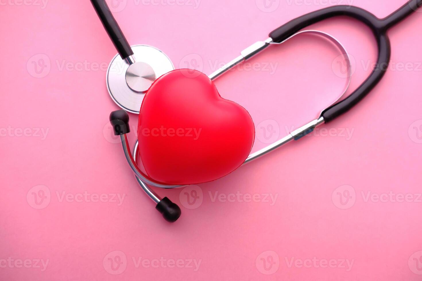 The concept of Heart Health and Medical Care represented with the use of a Stethoscope photo