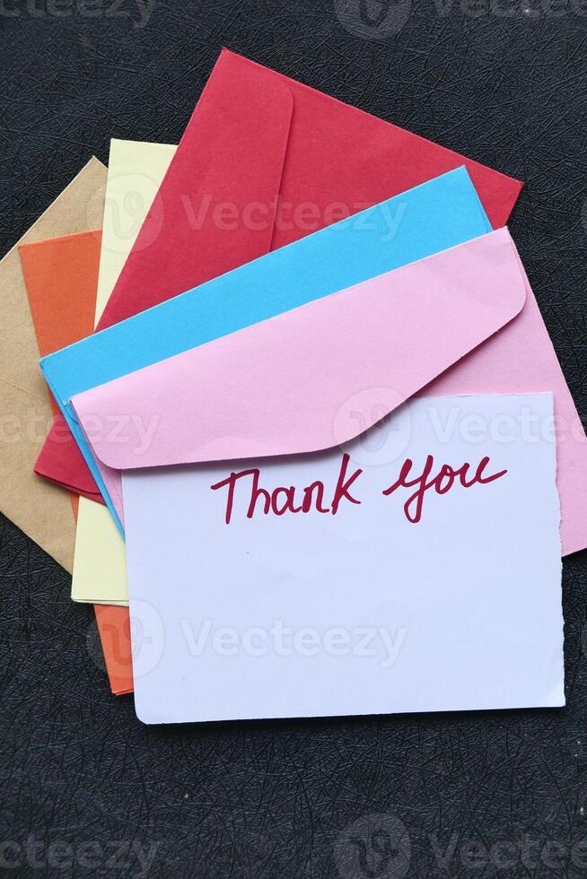 A colorful stack of Thank You cards with matching envelopes for extra flair and style photo