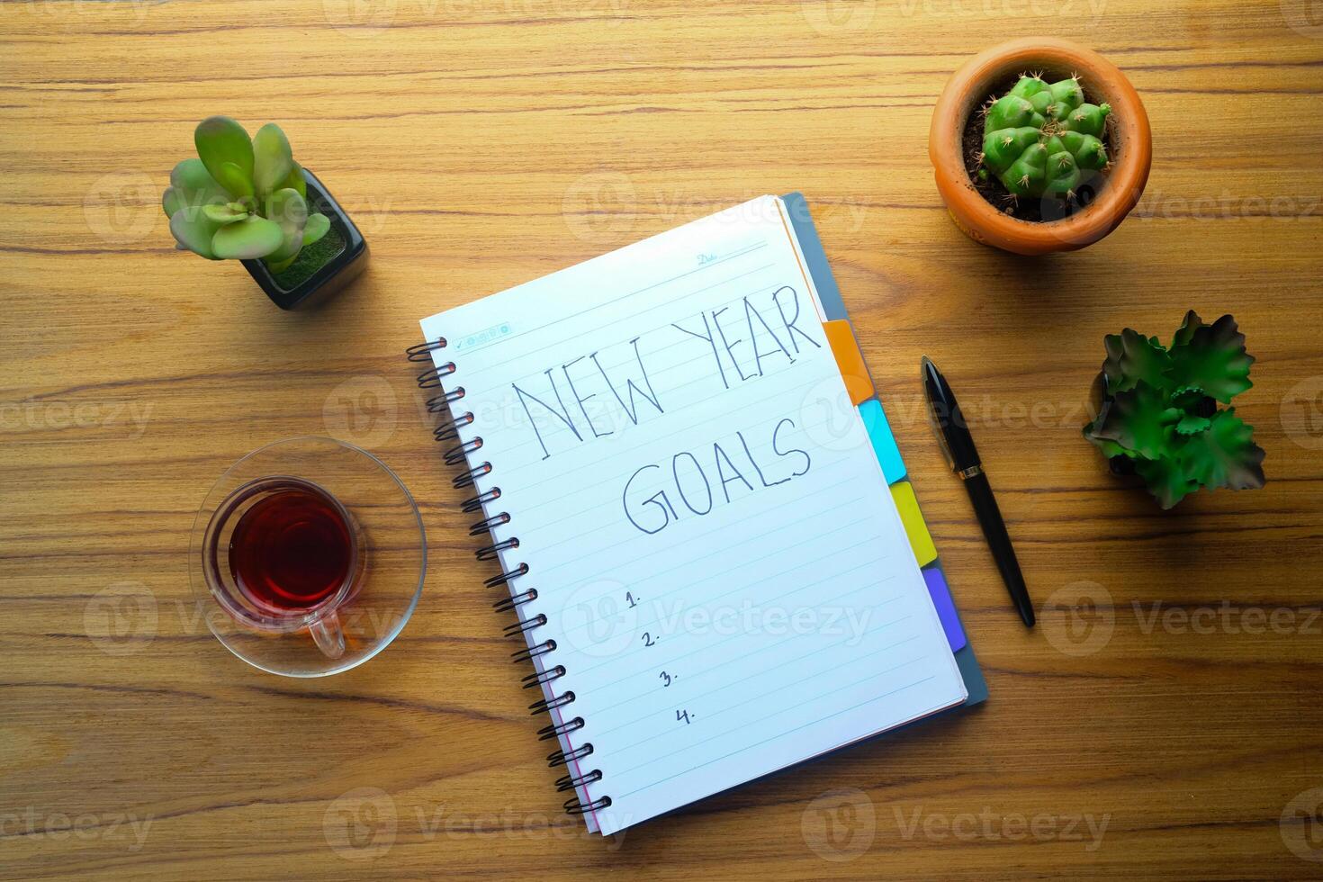 Strategically Planning New Year Goals with a Cozy and Inviting Workspace Environment photo