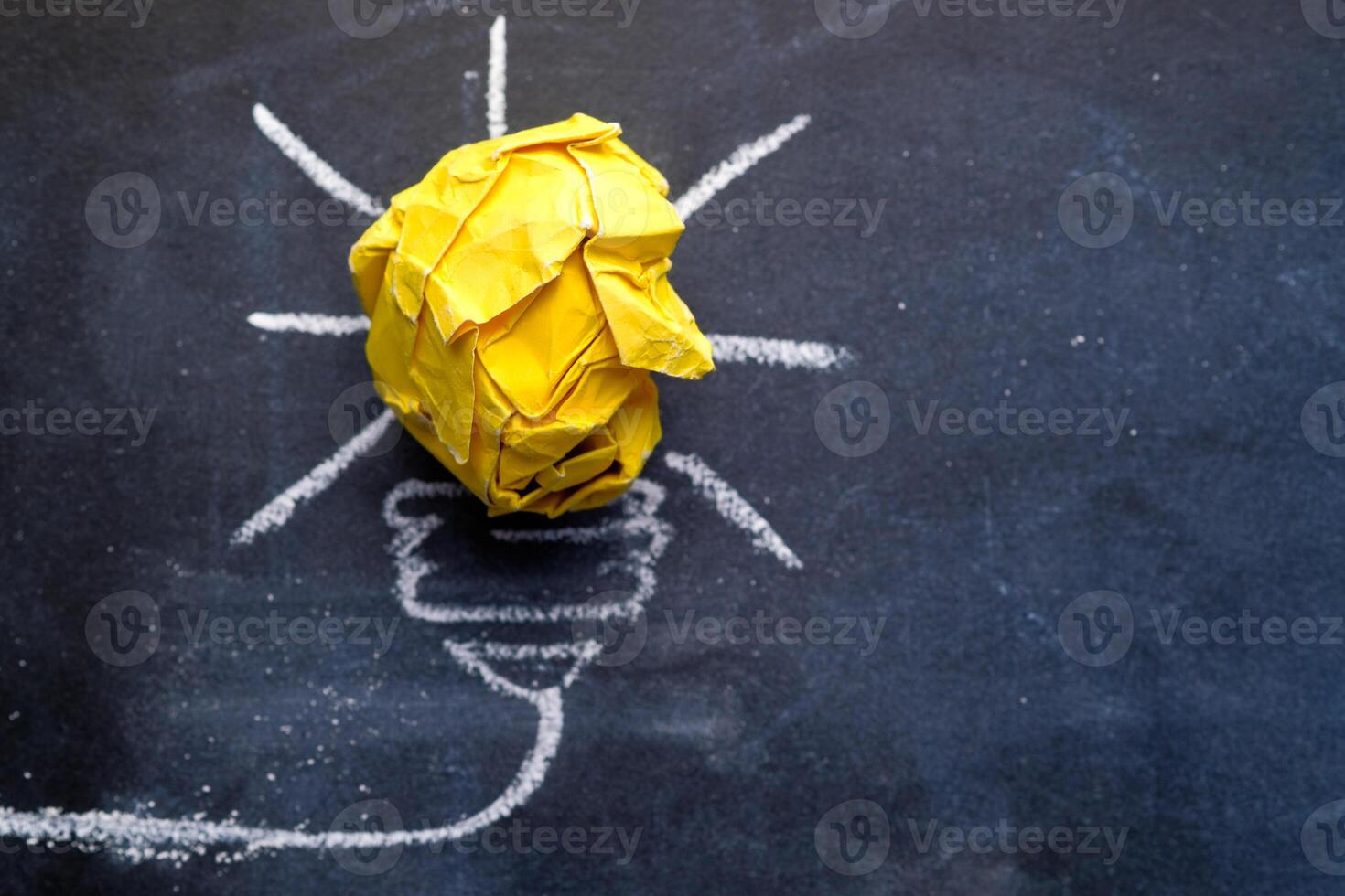 An innovative and imaginative concept illustrated by a creative light bulb made from crumpled paper photo