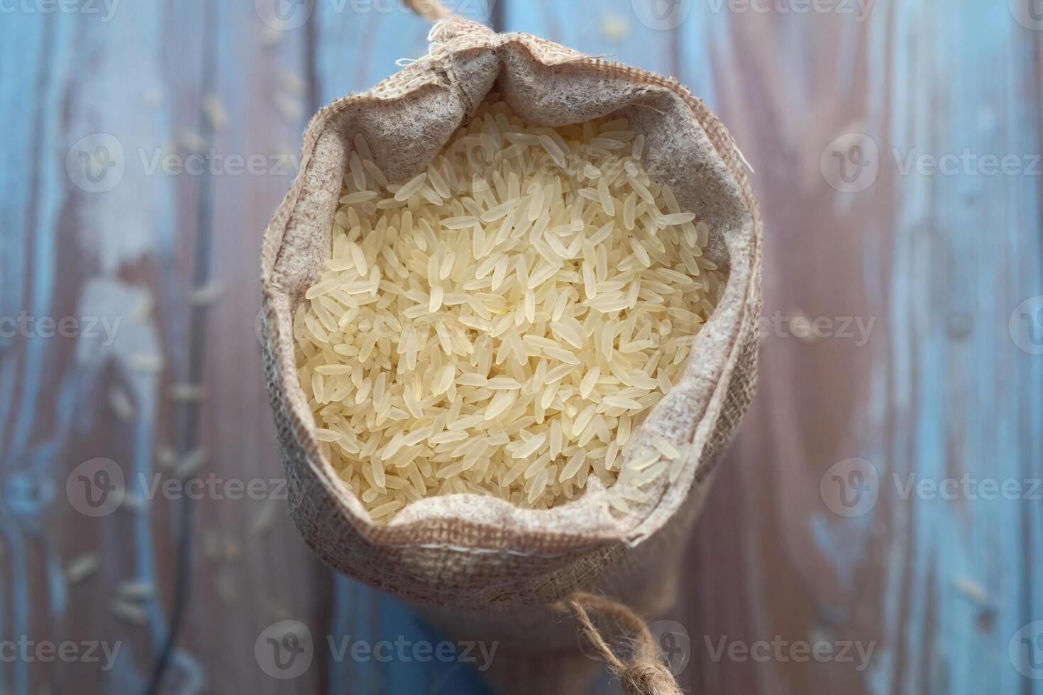 An Aerial Perspective View of a Burlap Sack That Is Completely Filled with Raw Rice Grains photo