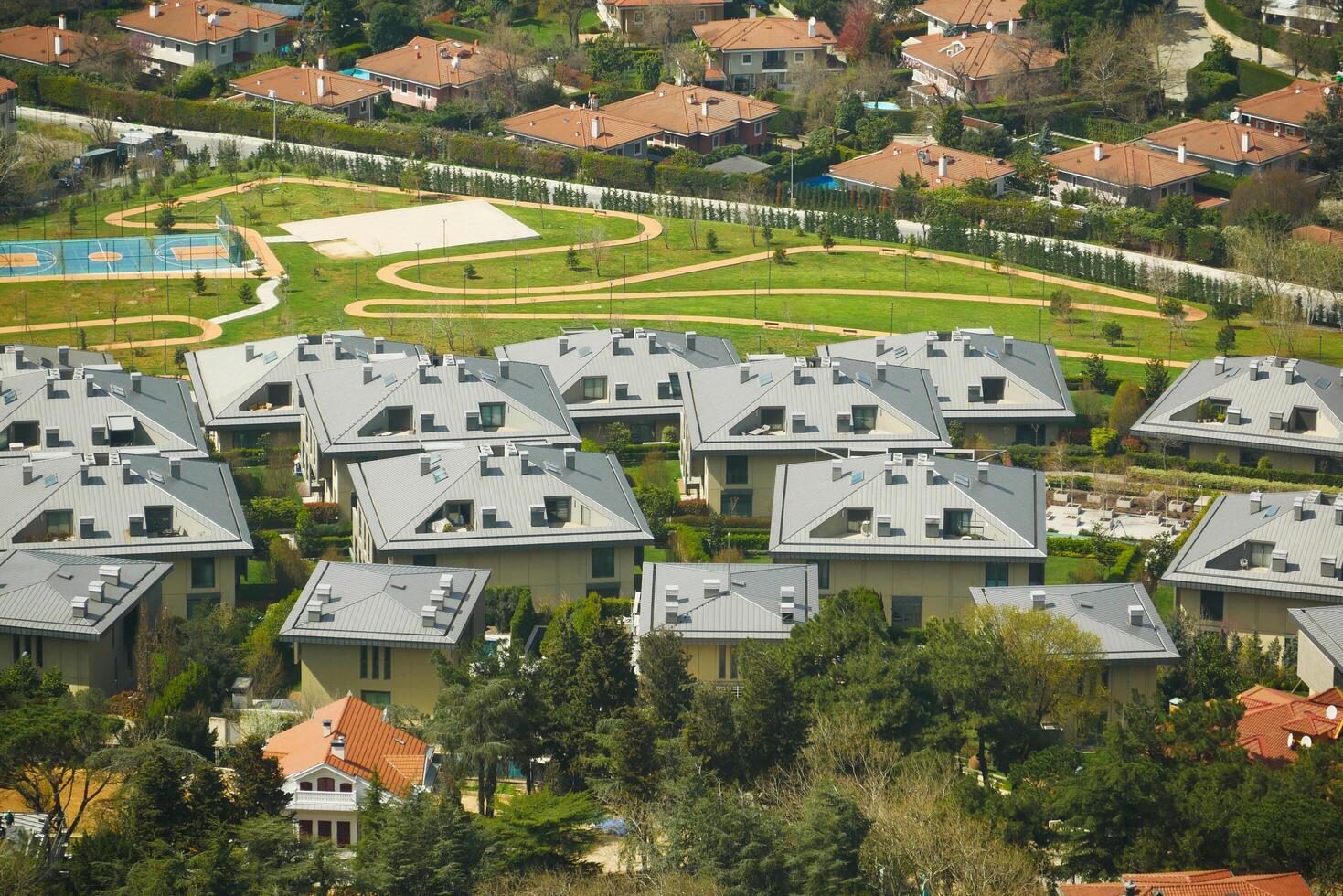 Turkey istanbul 24 june 2023. Aerial View of a Contemporary Residential Area Featuring Green Spaces and Rooftops for Living photo