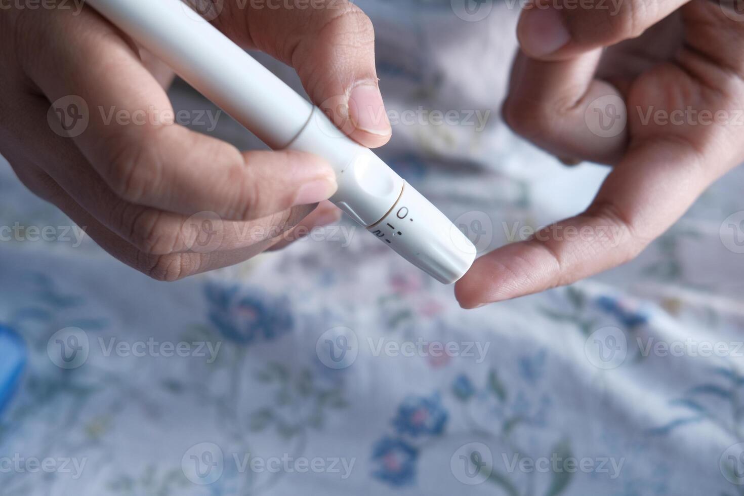 A person actively utilizing a specialized device for the purpose of glucose monitoring efficiently photo