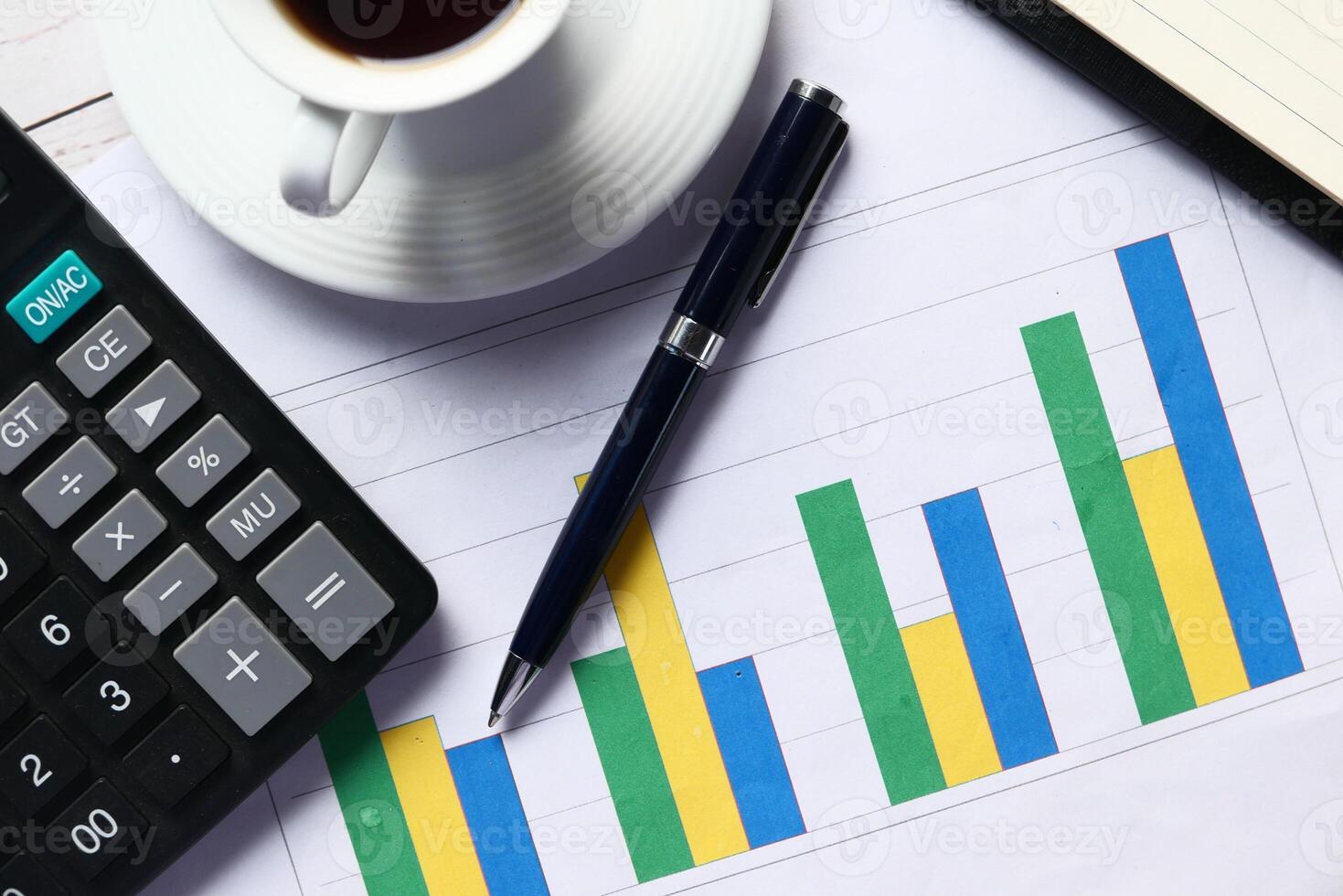 Business Analytics and Financial Growth Chart accompanied by a Cup of Coffee on Desk photo