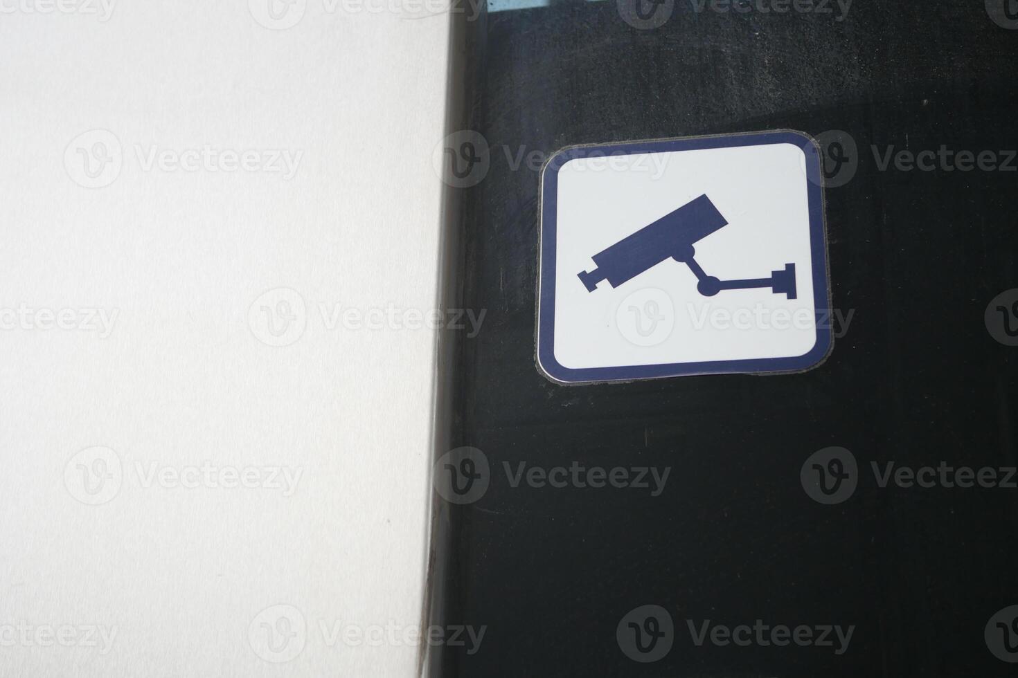 A Security Camera Icon is prominently displayed against a Dark Background for emphasis photo
