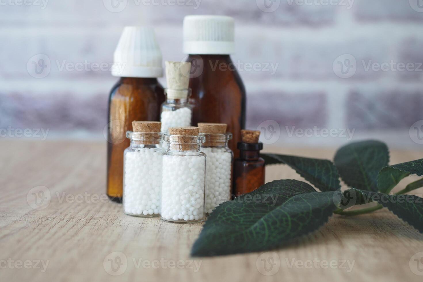 Homeopathic pills containers on a table photo