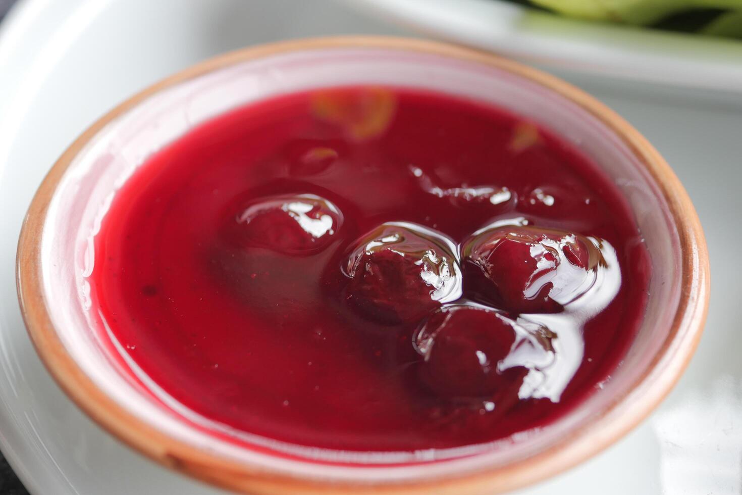 A Bowl Filled with Exquisite and Delicious Cherry Sauce Ready to Enhance Your Dishes photo